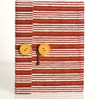 Handmade diary with fabric overlapping cover and wooden button closure