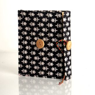 Black handmade diary with white pattern fabric cover and buttoned flap