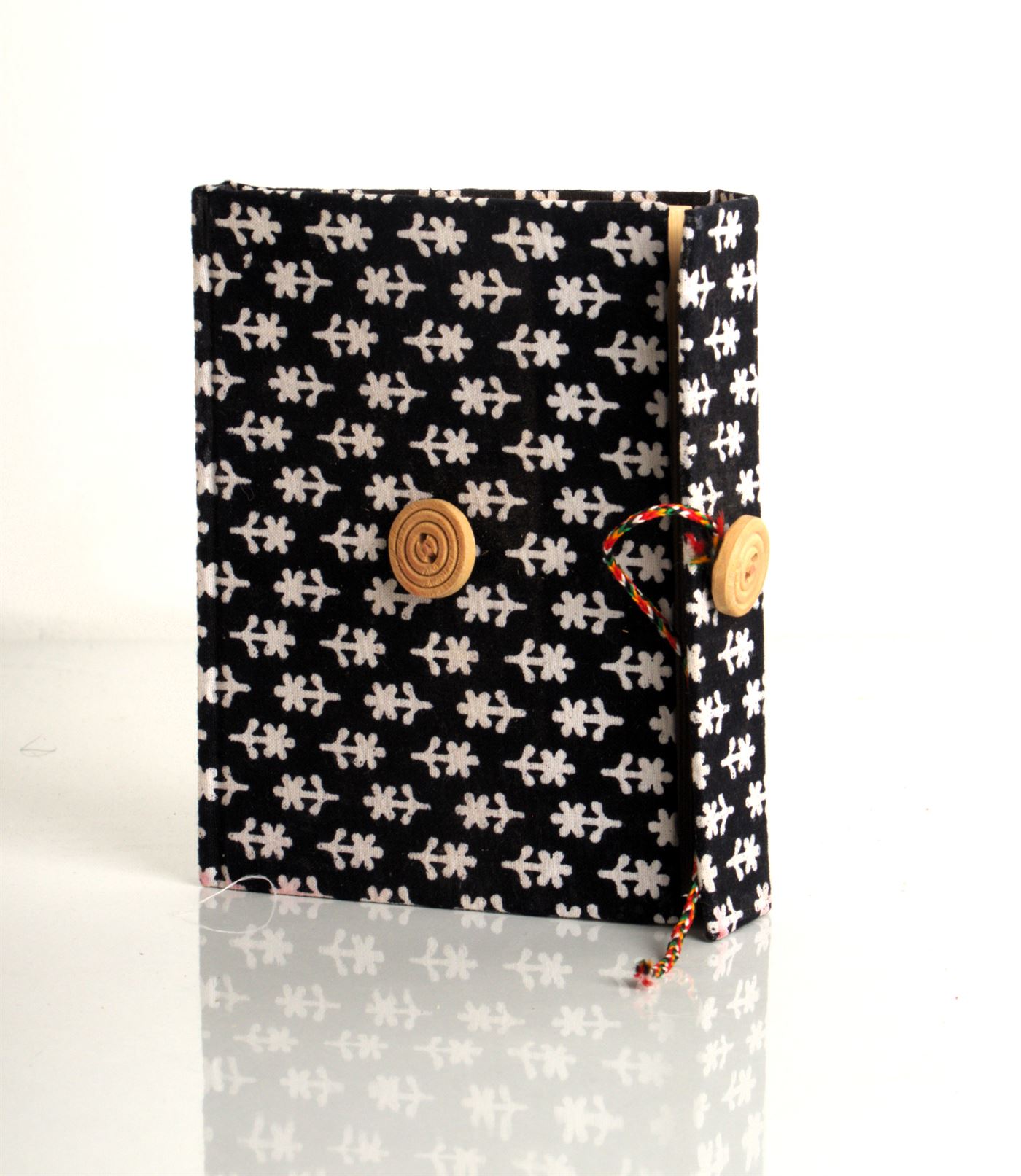 Black handmade diary with white pattern fabric cover and buttoned flap